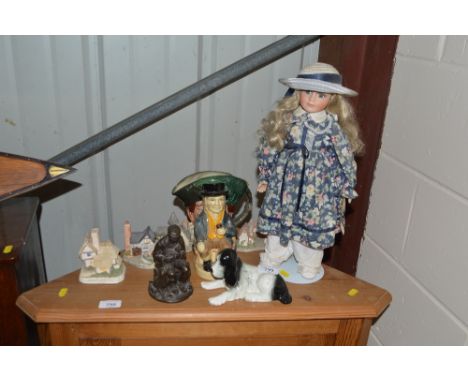 A Royal Doulton character jug in the form of a Cavalier; and a Tony Wood Toby jug; four model houses; a bronzed ornament etc.