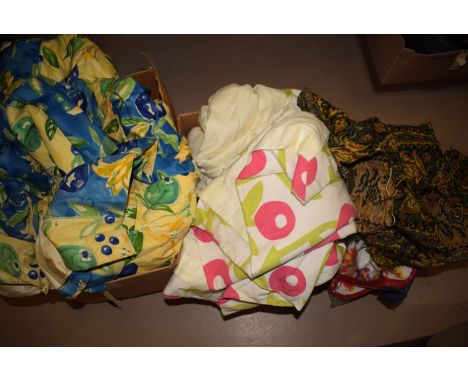 Two boxes of miscellaneous fabrics, to include: a pair of curtains, possibly by Liberty; a tapestry handbag; and a bag contai