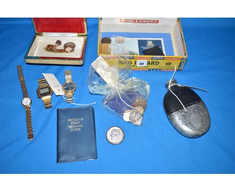 A hip flask with metal cup; a small quantity of coinage; costume watches; and other items.