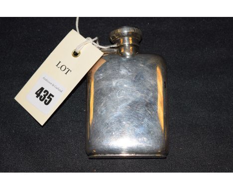 A miniature plated hip flask with Victorian registration number; together with a glass hip flask with leather cover and plate