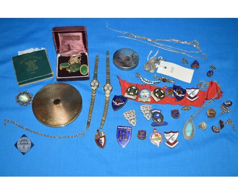 A quantity of  enamel badges; various costume watches; a Japanese patinated white metal compact; a Chinese style green stone 