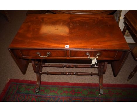 A reproduction inlaid mahogany sofa table, 35in. wide.