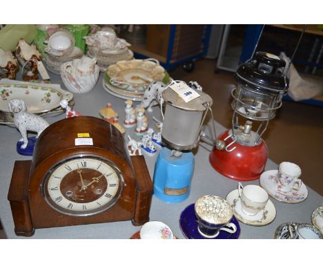 Early 20th Century mantle clock; a camping Gaz lamp; a modern red and black Tilly Lamp.  (3)