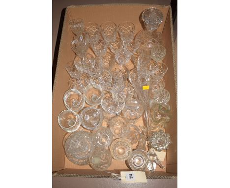 A box of assorted wine glasses and a decanter.