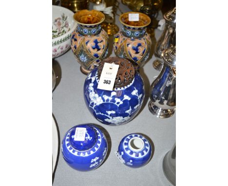 Three graduating ceramic Oriental ginger jars, one with a wooden cover; together with a pair of Doulton Lambeth ceramic vases