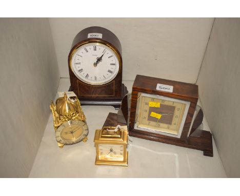 Two Swiss made Swiza brass alarm clocks; together with an oak and chrome Art Deco style clock; and a modern quartz movement m