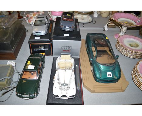 Five large scale models of sports cars, comprising: a Jaguar X-type (2001); an Audi TT; a Jaguar XC220; Mercedes Benz 500K; a