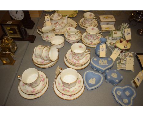 A Paragon china 'Victoriana Rose' pattern eight-piece tea set, comprising: seven cups, saucers, plates, two cream jugs and tw