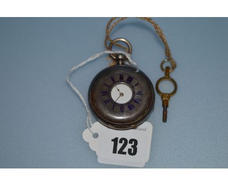 A silver cased half hunter fob watch, with blue enamel roman dial to outer case and white enamel roman dial under.