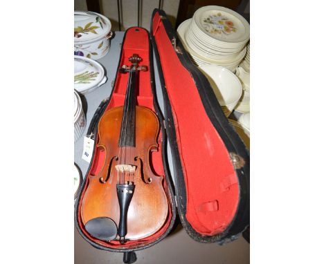 A 20th Century violin, with interior paper label 'Antonius Stradivarius, Made in Germany', in fitted case (no bow).