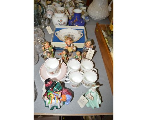 A collection of five Hummel figures; a Royal Doulton figurine HN2017 'Silks & Ribbons'; a Coalport figurine 'Pamela'; a Susie