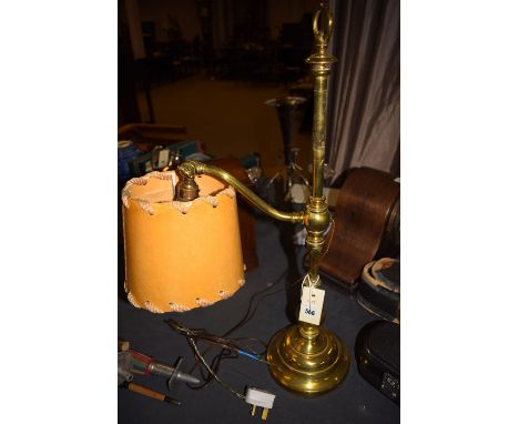 An early 20th Century glass gas lamp, with adjustable height, loop handle to the top and round base, converted to electricity