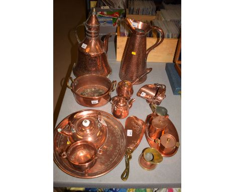 A quantity of copper ware, to include: a miniature helmet-shaped coal scuttle; an oval dish with brass handles; an Art Nouvea