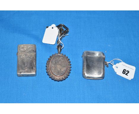 Two silver vesta cases; together with a Victorian silver locket pendant; and a gate link chain. 