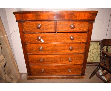 A Victorian mahogany scotch chest of two short and four long drawers fitted turned handles.