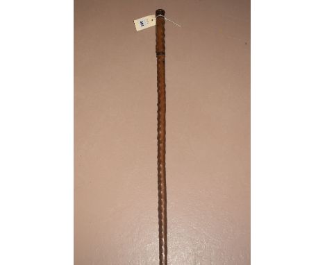 A gentleman's old walking cane/decanter stick, the top opening to reveal a long glass.