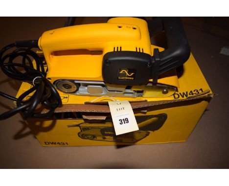 A Dewalt electric belt sander, model no. DW431.