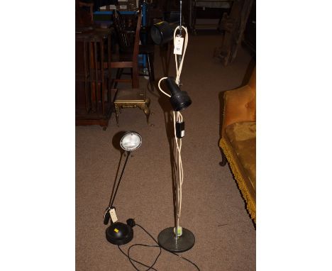 A mid 20th Century floor lamp with two anglepoise lamp fittings on circular metal base, 48in. high., probably by Peter Nelson