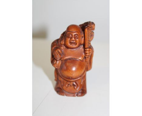 A carved boxwood netsuke 