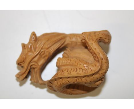 A carved boxwood netsuke 