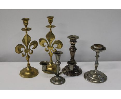 A selection of assorted vintage candlesticks 
