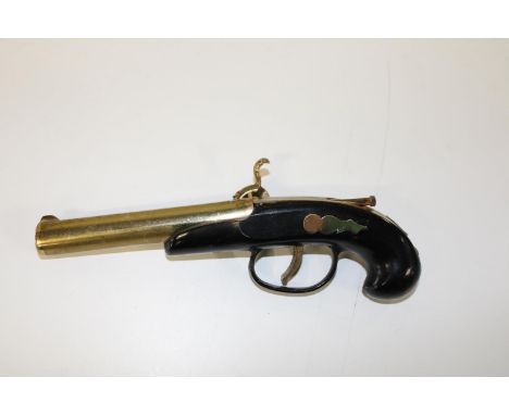 A novelty vintage lighter in the form of a flintlock pistol 