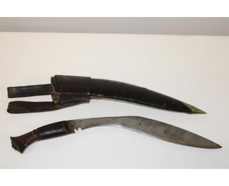 A WW1 period Kukri with wooden handle &amp; leather scabbard, with belt attachment 