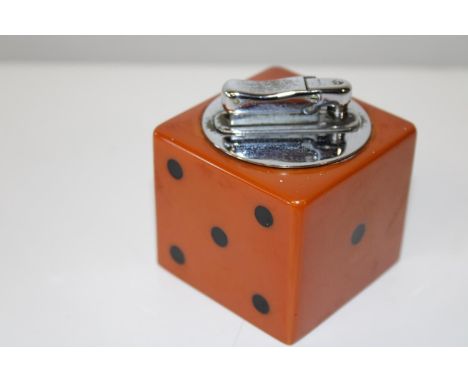A vintage 1950's novelty bakelite table lighter in the form of a dice 