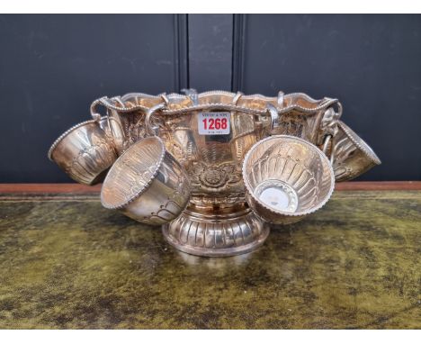 A large electroplated punch bowl and eight cups,&nbsp;32cm diameter; together with associated ladle.&nbsp; &nbsp; 