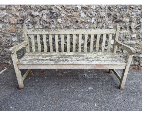 A teak garden bench, 152cm wide. 