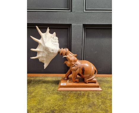 An unusual Indian hardwood elephant and shell table lamp,&nbsp;37.5cm high.&nbsp; 