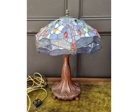 A bronzed, stained and leaded glass table lamp, 57cm high. 