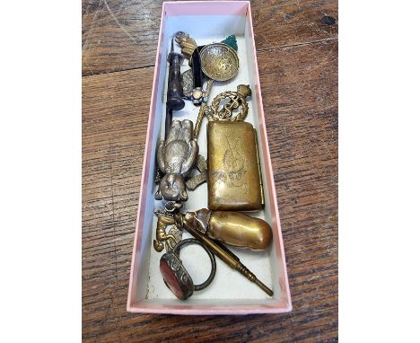 A mixed lot of works of art,&nbsp;to include a 9ct gold mounted jade Buddha pendant, 15mm high; a brass pig vesta; and a seal