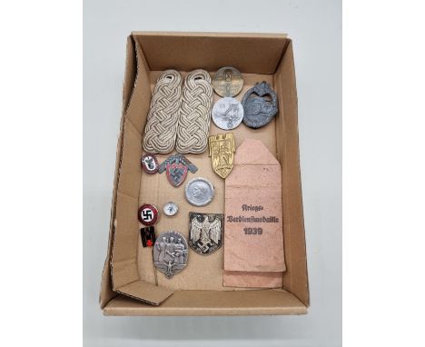 A collection of German Third Reich military, party and other badges; together with a pair of Wehrmacht Field Officer's should