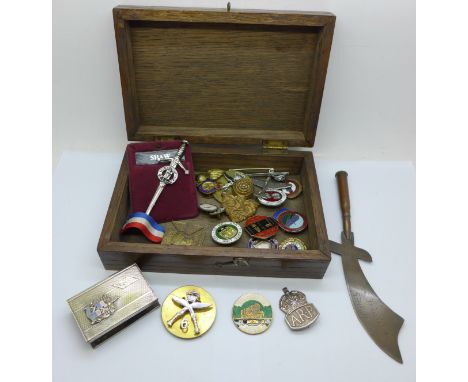 Military and other badges including silver ARP and ASLEF railway badges and a trench art letter opener, etc. 