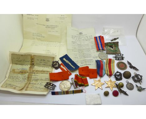 Four WWII medals to 97803 R.B. Davidson, a Boy Scout Marksman Proficiency Certificate to Robert Davidson dated 1926, a small 