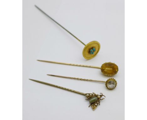 Three stick pins including a pearl and stone set fly, a/f, and a hat pin set with turquoise and pearl 