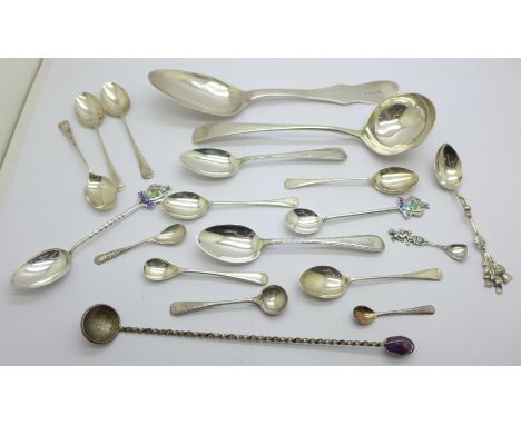 A collection of silver spoons including a Georgian ladle, a large continental spoon, tea spoons, condiment spoons, etc., 236g