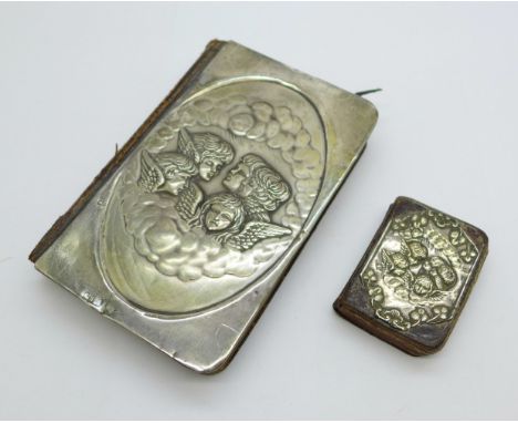 A silver fronted common prayer book and one other smaller, both decorated with Reynold's Angels, smaller cover a/f 