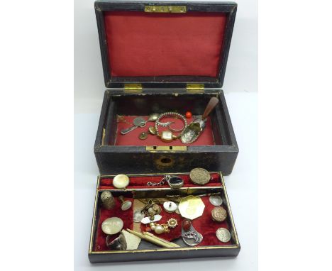 A jewellery box with jewellery, etc., including a silver caddy spoon with replacement handle, a swivel fob, etc. 