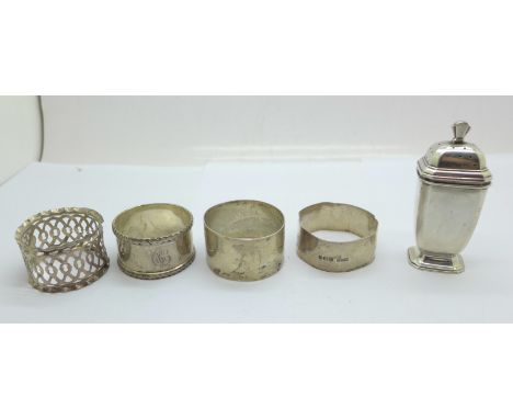 Four silver napkin rings, two a/f, and a silver pepper, 115g 