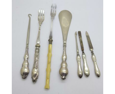 Three silver manicures, a silver handled shoe horn and button hook and two forks 