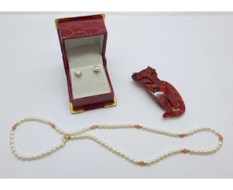 A pair of 9ct gold and pearl earrings, a pearl and coral necklace and a costume brooch 