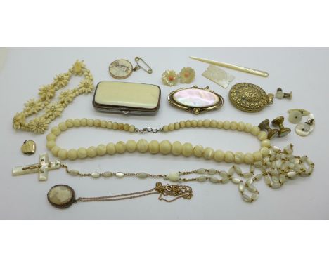 Costume jewellery including a Victorian mother of pearl brooch, beads, earrings, rosary beads, locket, etc. 