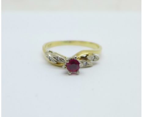 An 18ct gold, ruby solitaire ring with diamond shoulders, 2.4g, M 