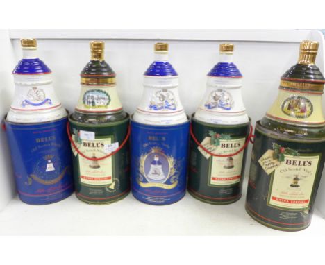 Five Bell's Old Scotch Whisky decanters in containers; three Extra Special 