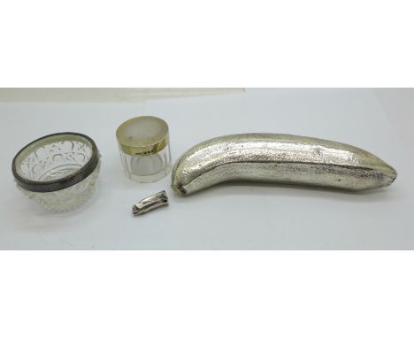 A silver banana (silver covered, marked 'Filled'), a/f, a silver rimmed salt and a silver topped glass pot 