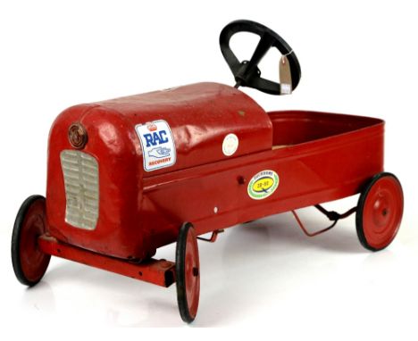 Tri-Ang red painted vintage pedal car, 75cm long,        General wear and tear consistent with age and use.Some rusting where