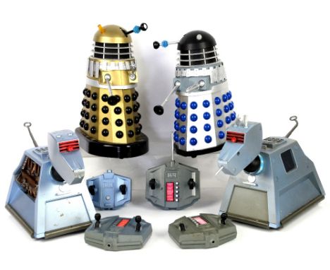 Two radio controlled K-9's and two Product Enterprise Ltd. radio controlled Daleks, silver/blue and gold/black, with controll