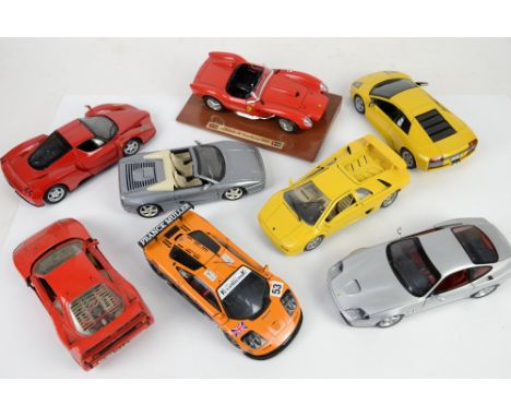 Eight 1:18 scale model sports cars, to include Burago Ferrari 250 Testa Rossa (1957), UT Models Ferrari 550 (1996), and six o